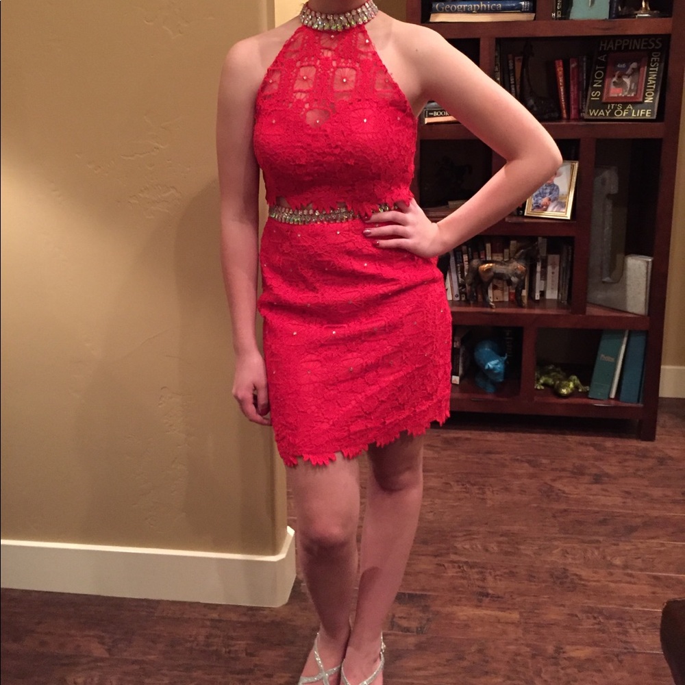 A red two piece co-ed high school dance dress.